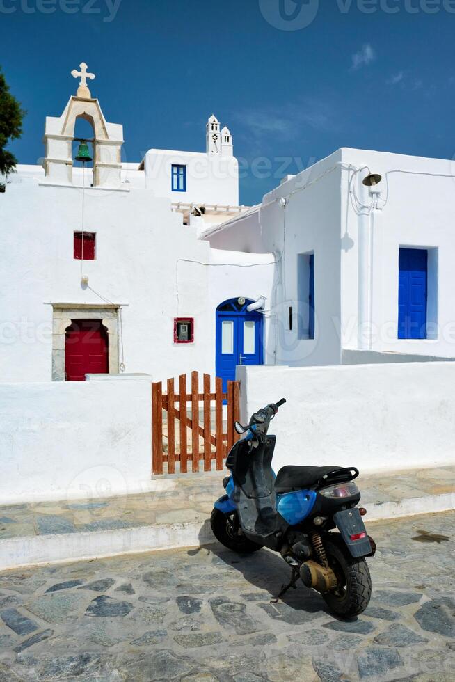 Motorcycle parked near orthodox christian church photo