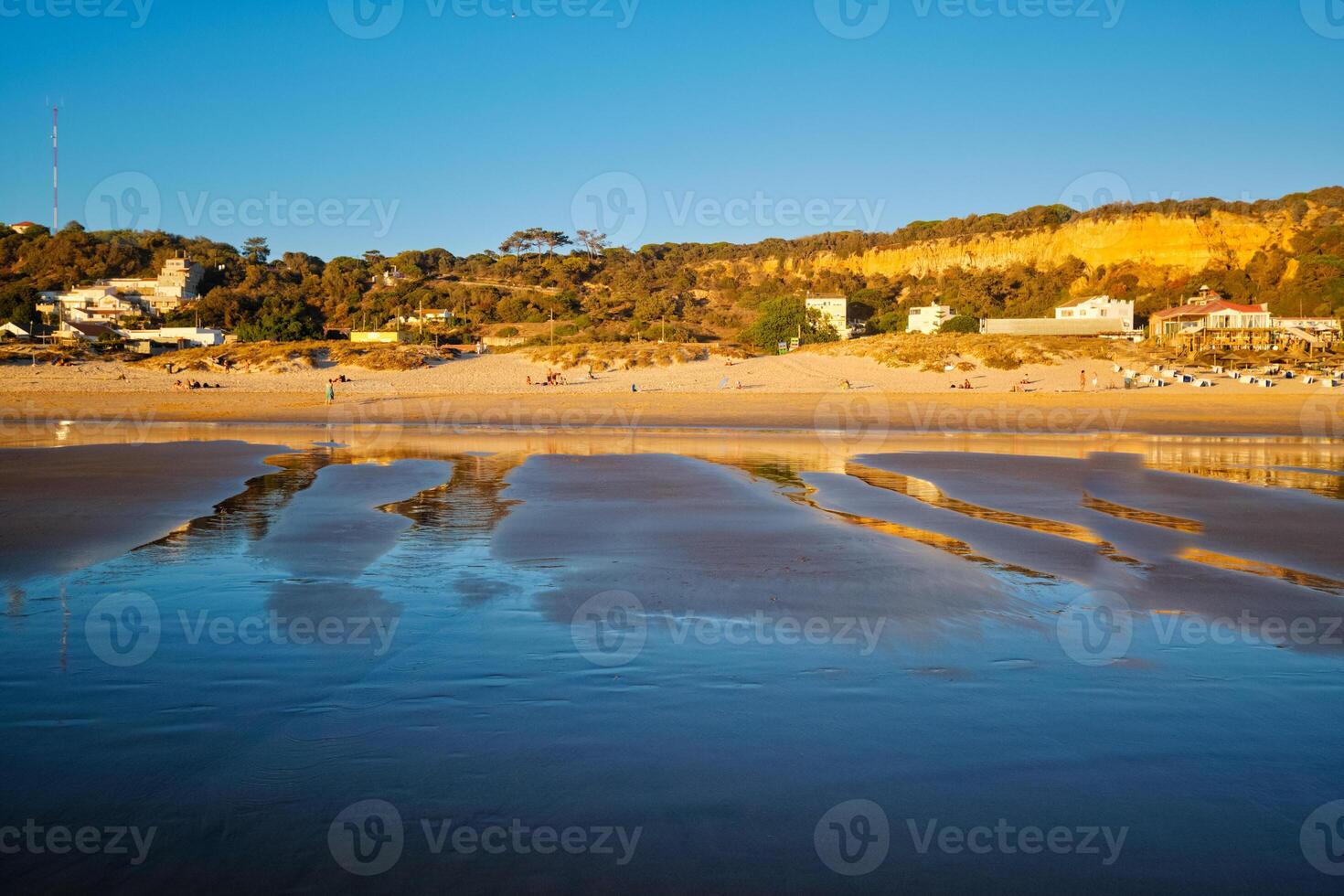 Atlantic ocean sunset with surging waves at Fonte da Telha beach, Portugal photo