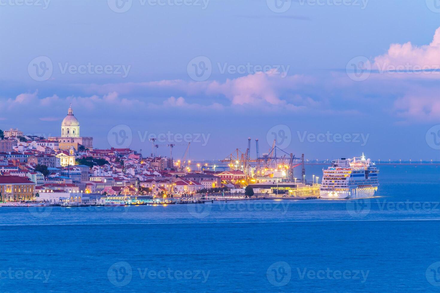 View of Lisbon over Tagus river in the evening. Lisbon, Portugal photo