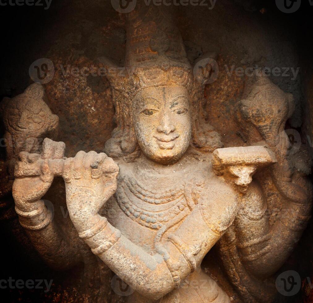 Krishna bas relief in Hindu temple. Sri Ranganathaswamy Temple. Tiruchirappalli Trichy, Tamil Nadu, India photo