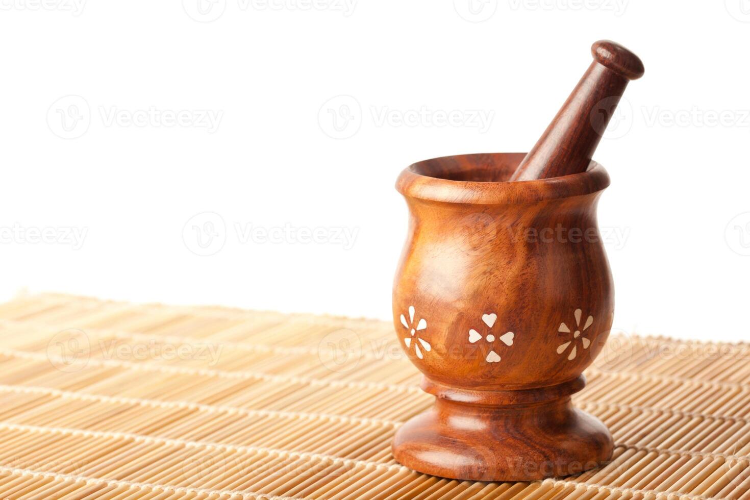 Wooden mortar with pestle photo