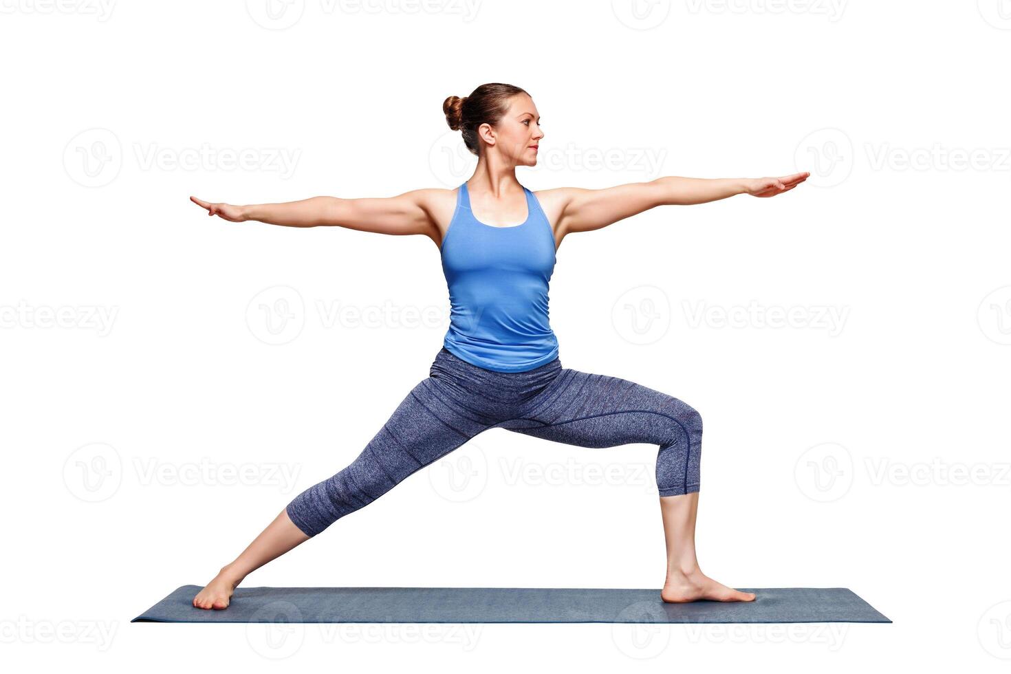 Sporty fit woman practices yoga asana utthita Virabhadras photo