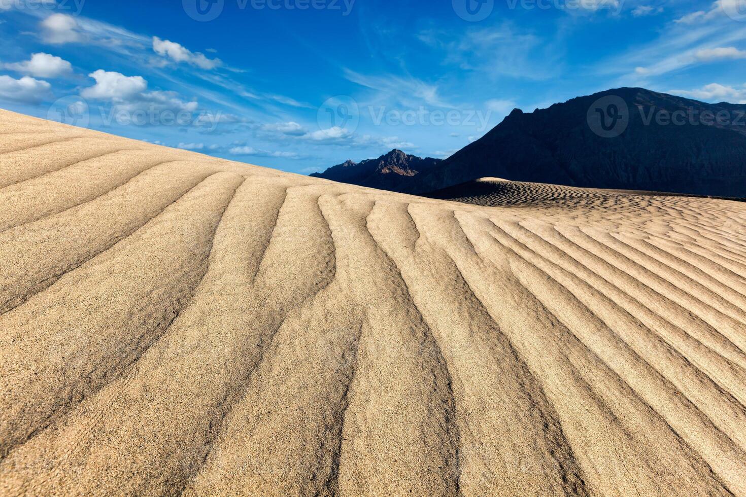 Sand dunes in mountains photo