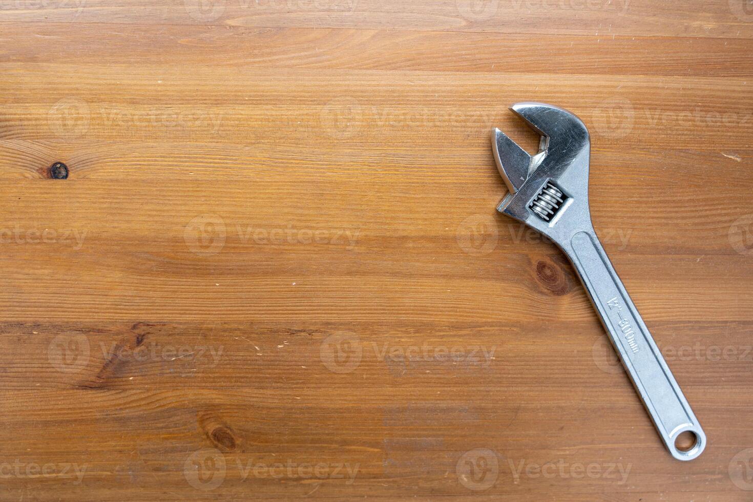 Wrench on Wooden Table photo