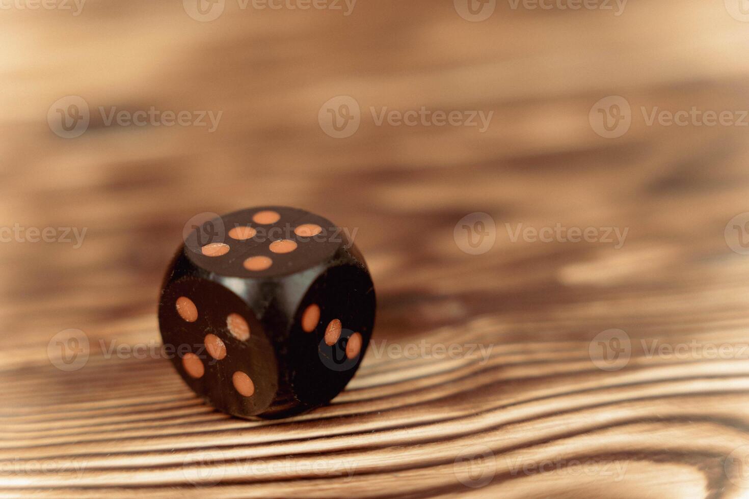Close-Up of Dice on Wooden Surface photo