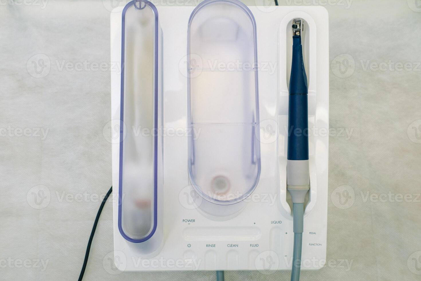 Ultrasonic scaler in the dental office. Dentistry Concept photo