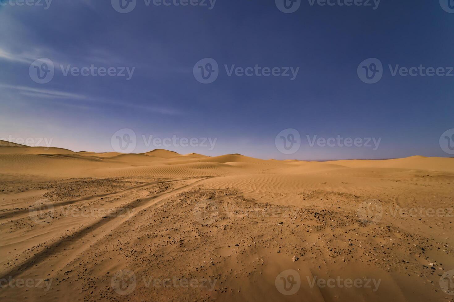 A panoramic sand dune of sahara desert at Mhamid el Ghizlane in Morocco wide shot photo