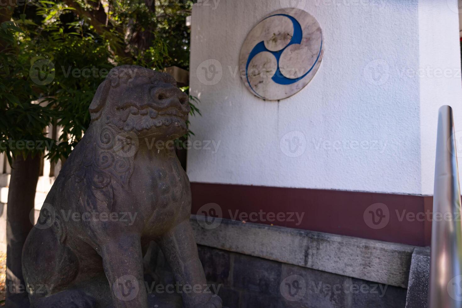 A guardian statue at Tomioka Shrine with copyspace photo