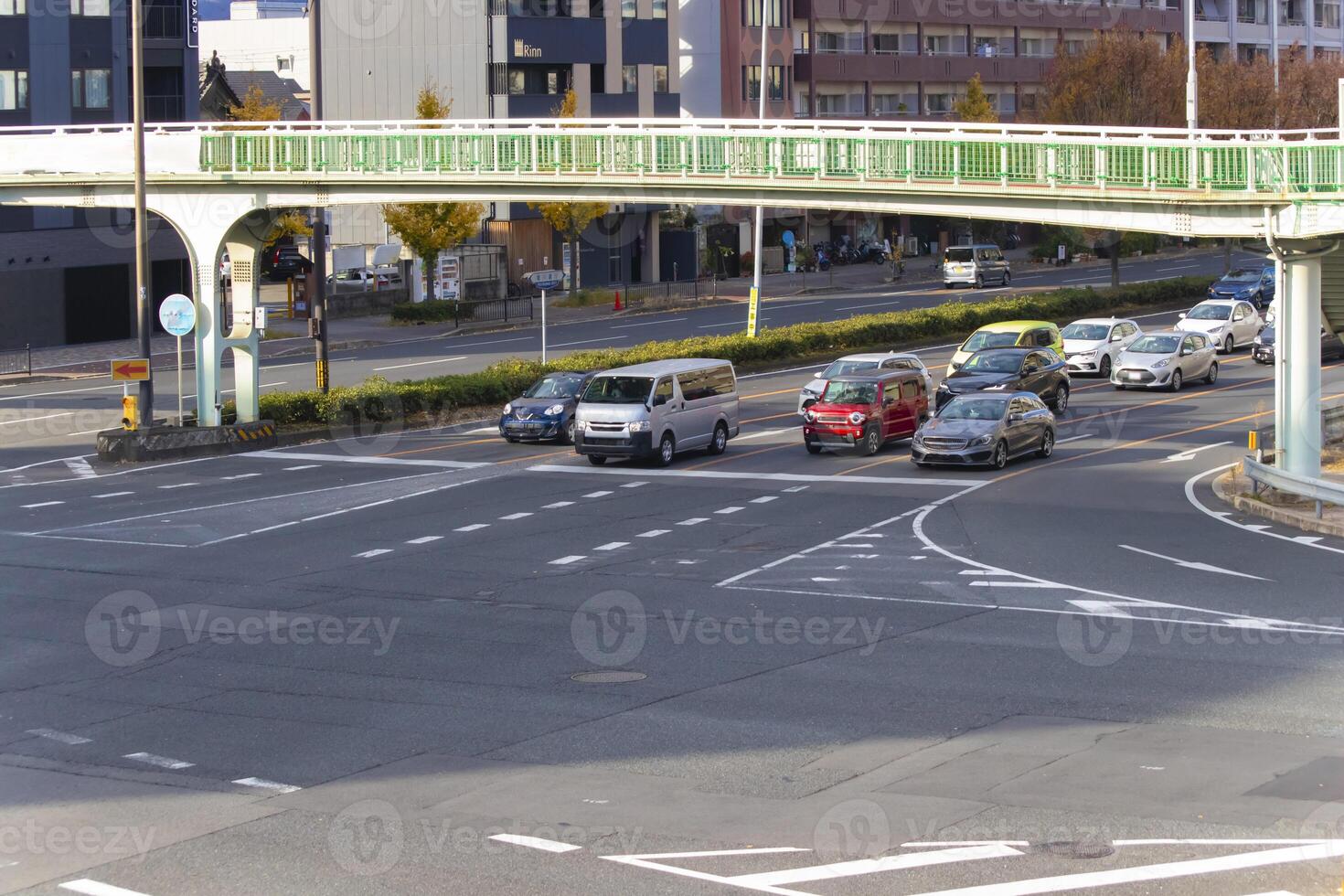 A traffic jam at the large crossing in Kyoto daytime photo