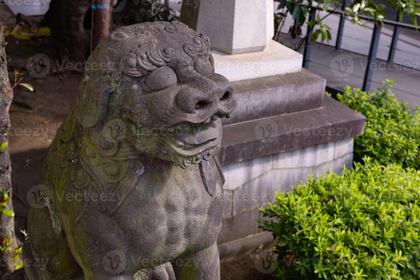 A guardian statue at Tomioka Shrine with copyspace photo