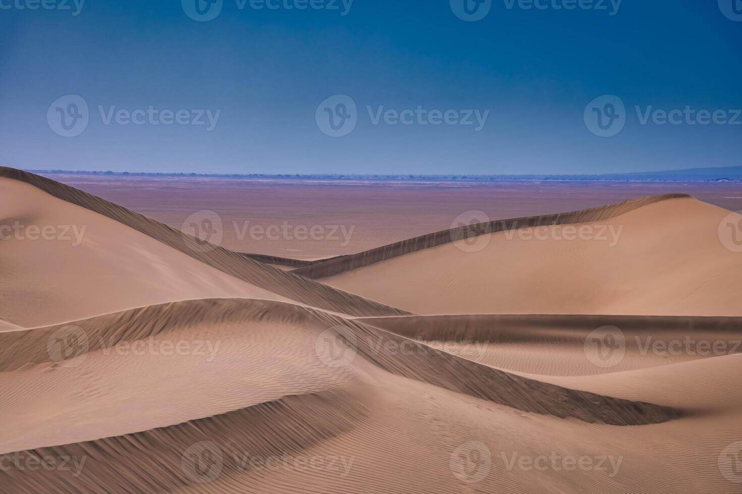 A sand dune of sahara desert at Mhamid el Ghizlane in Morocco telephoto shot photo