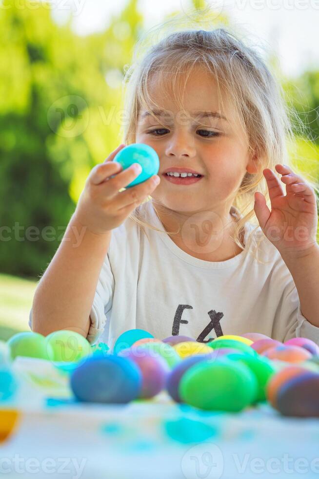 Happy Baby Coloring Easter Eggs photo