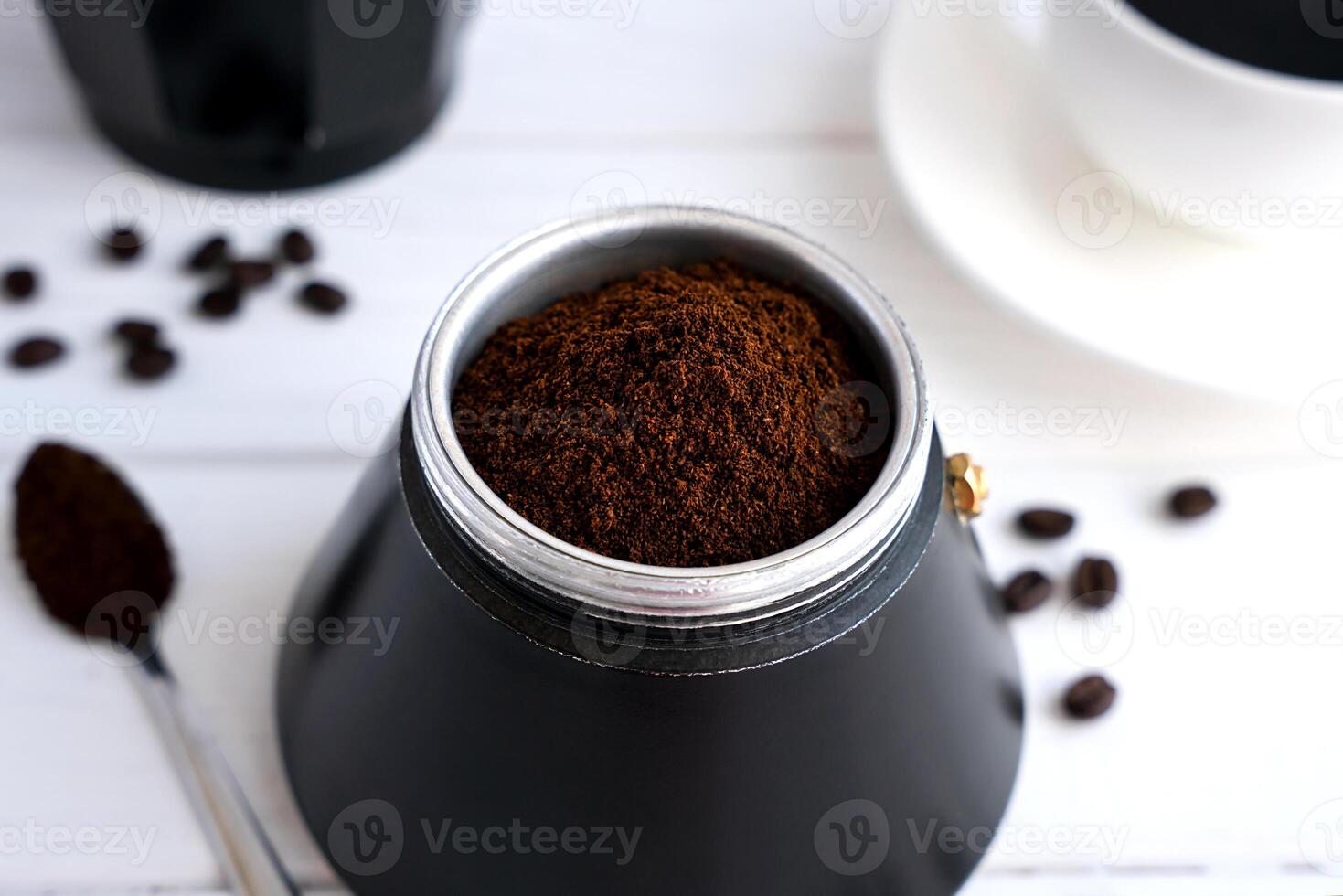 The concept of preparing natural coffee in a geyser coffee maker. Aromatic coffee for breakfast. Close-up. Selective focus. photo