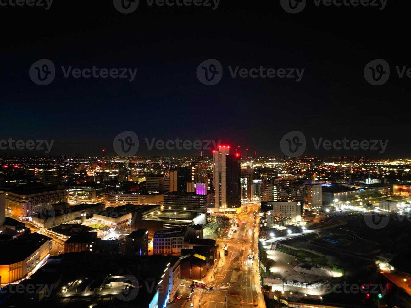 Aerial Night View of Illuminated City Centre Buildings of Birmingham Central City of England United Kingdom. March 30th, 2024 photo