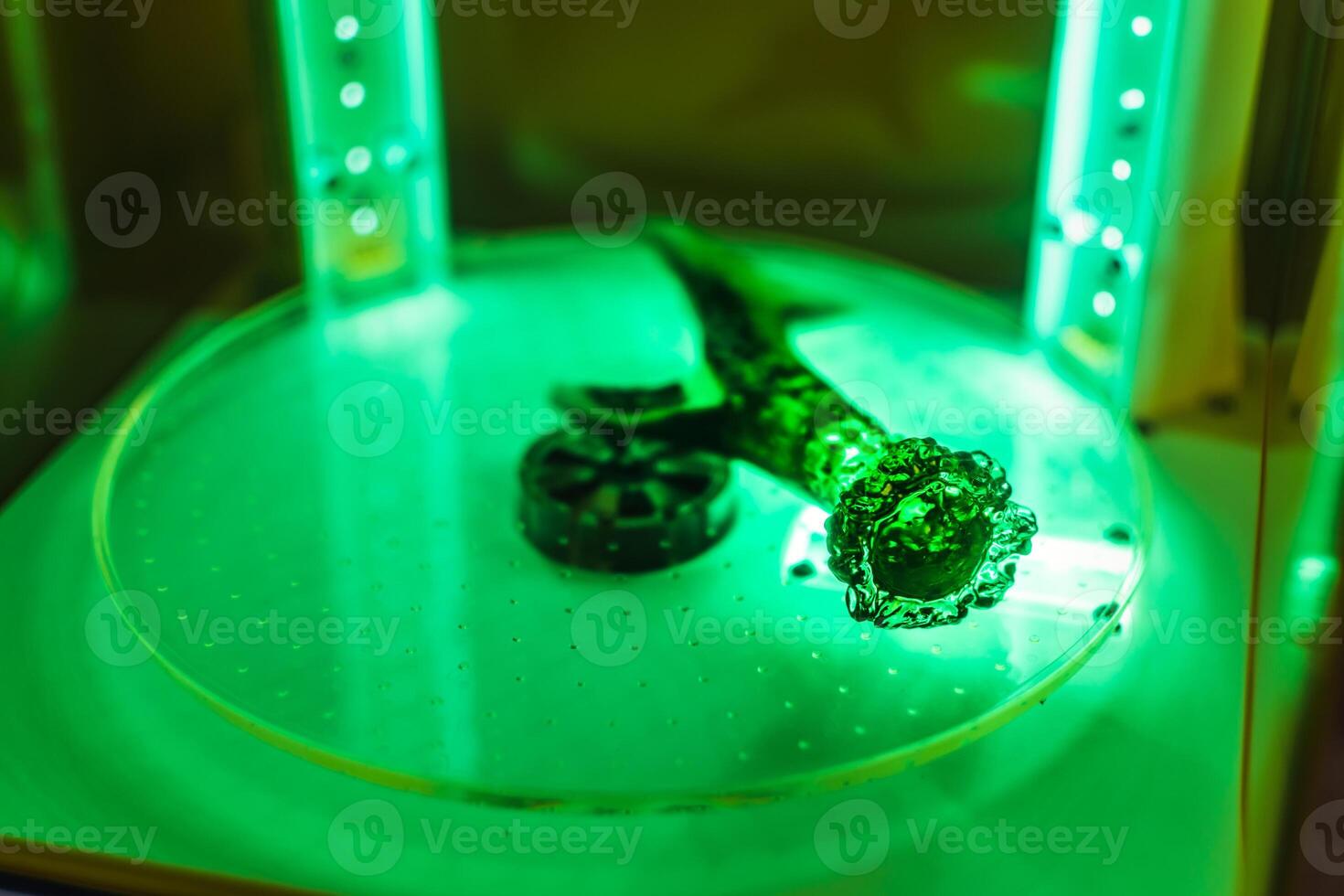 3d resin printing of a deer antler turning in a cure machine using UV light photo
