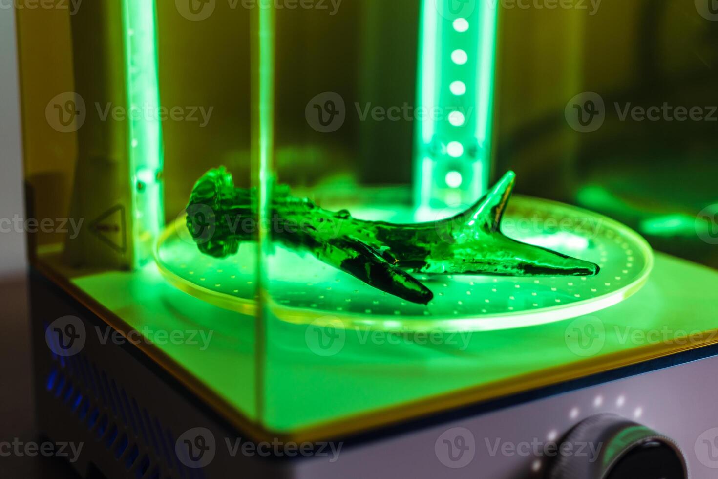 3d resin printing of a deer antler turning in a cure machine using UV light photo