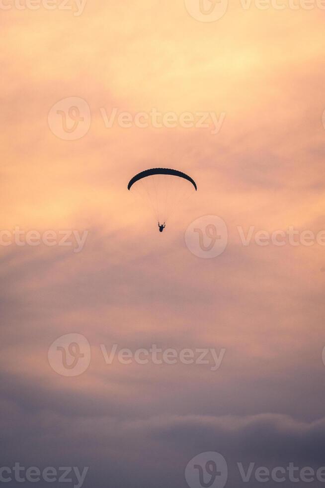 Paragliding in the sky of Sao Vicente, Brazil. photo