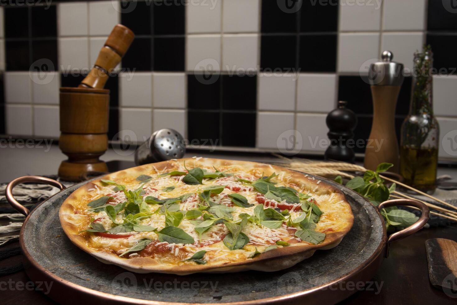 Brazilian pizza with pepperoni, cheese  arugula photo