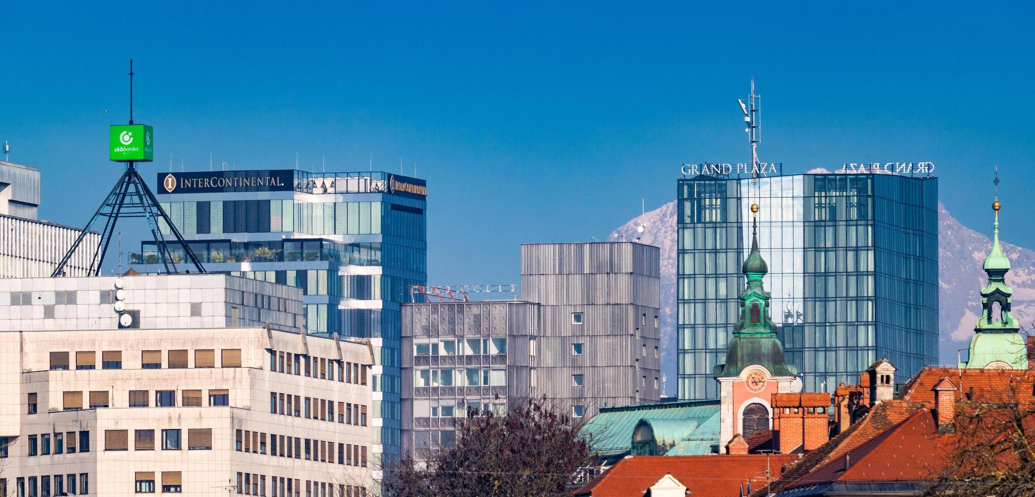 Ljubljana, Slovenia - December 23, 2023. Downtown Ljubljana, the Intercontinental and Grand Plaza hotels, Avtotehna building, SKB bank and Franciscan Church of the Annunciation. photo