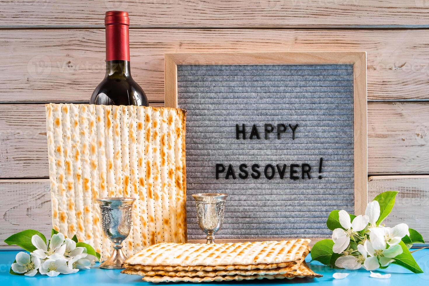 Celebrating spring holiday Passover. Bottle of wine and traditional Jewish matzo bread photo