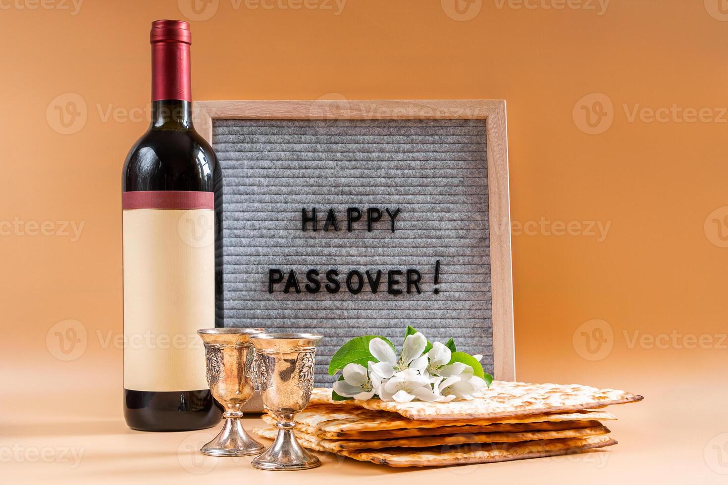 Happy Passover. Bottle of wine, spring flowers and matzah bread photo