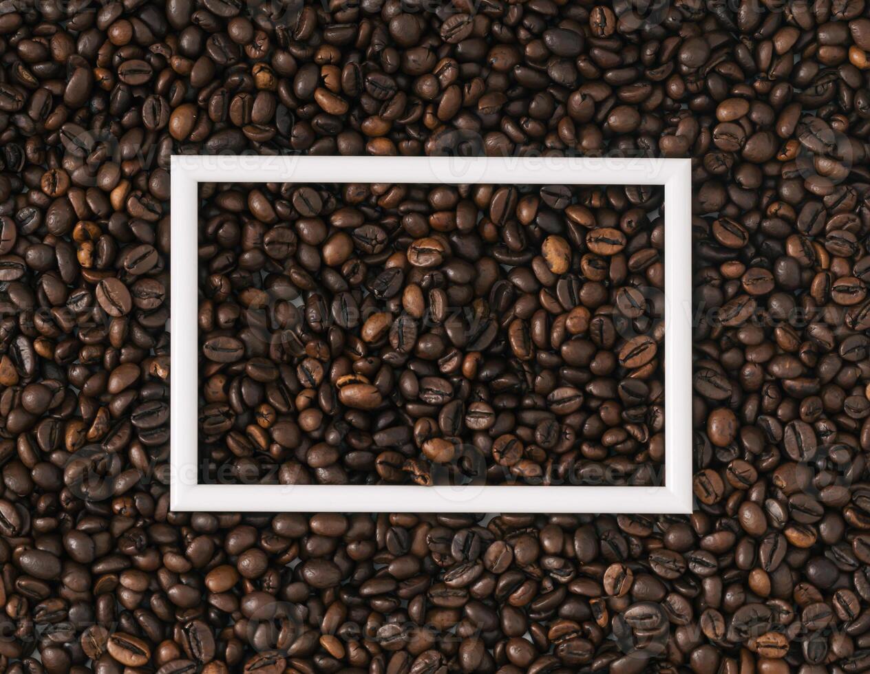 Roasted coffee beans background with white frame copy space. Minimal concept and simplicity. Coffee aesthetic background. Flat lay, top of view. photo