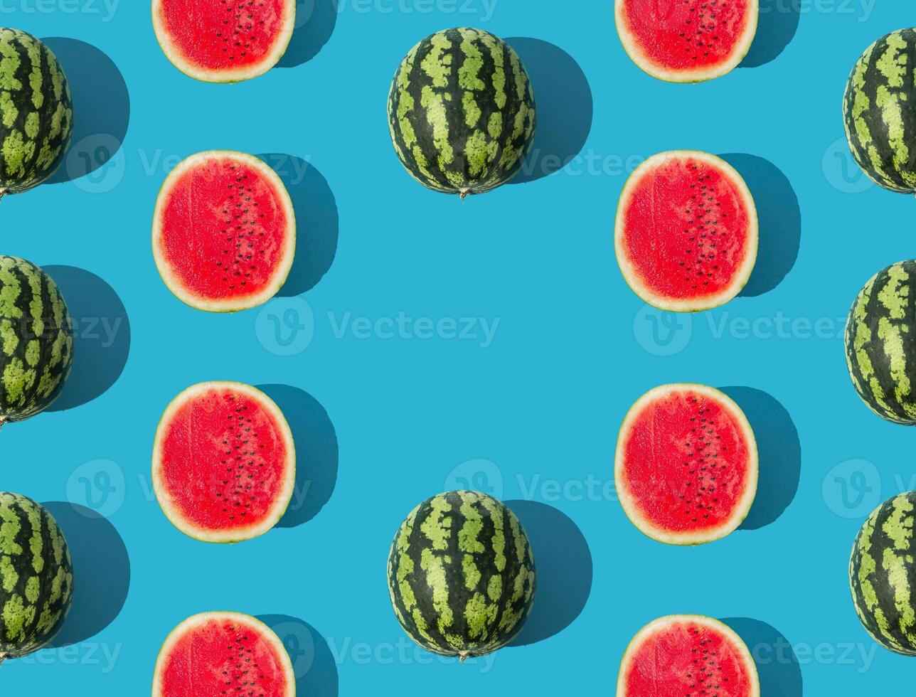 Trendy fruit pattern composition made with ripe and fresh watermelon on blue background. Minimal summer food concept. Creative summer pattern background with copy space idea. Watermelon aesthetic. photo