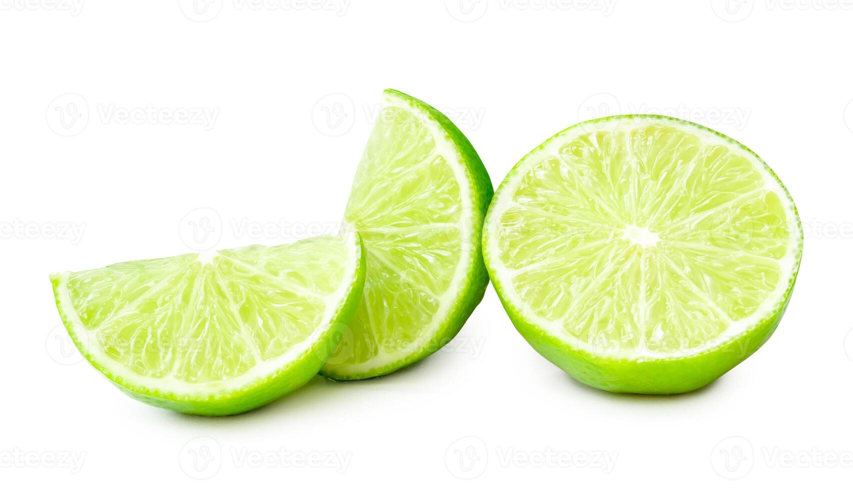 Front view of fresh green lemon half with slices or quarters isolated on white background with clipping path photo