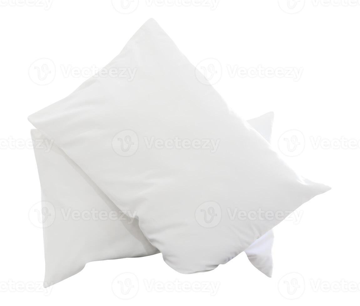 Two white pillows with cases after guest's use in hotel or resort room isolated on white background with clipping path photo