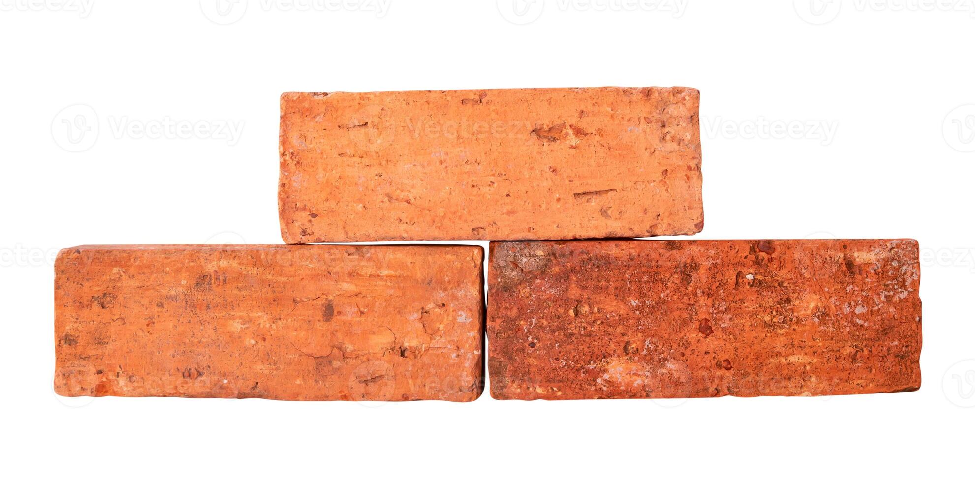 Front view of old cracked red or orange bricks in stack isolated on white background with clipping path photo