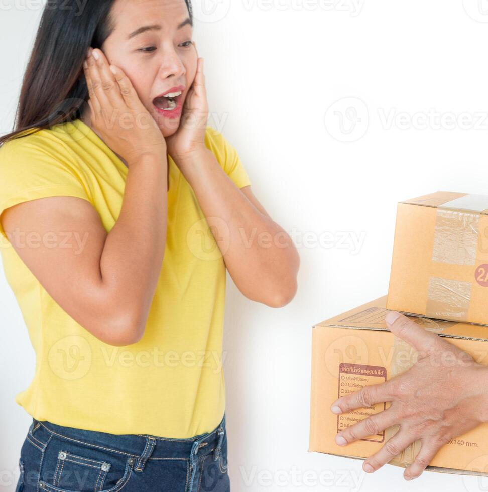 Woman receiving parcel from delivery man. photo