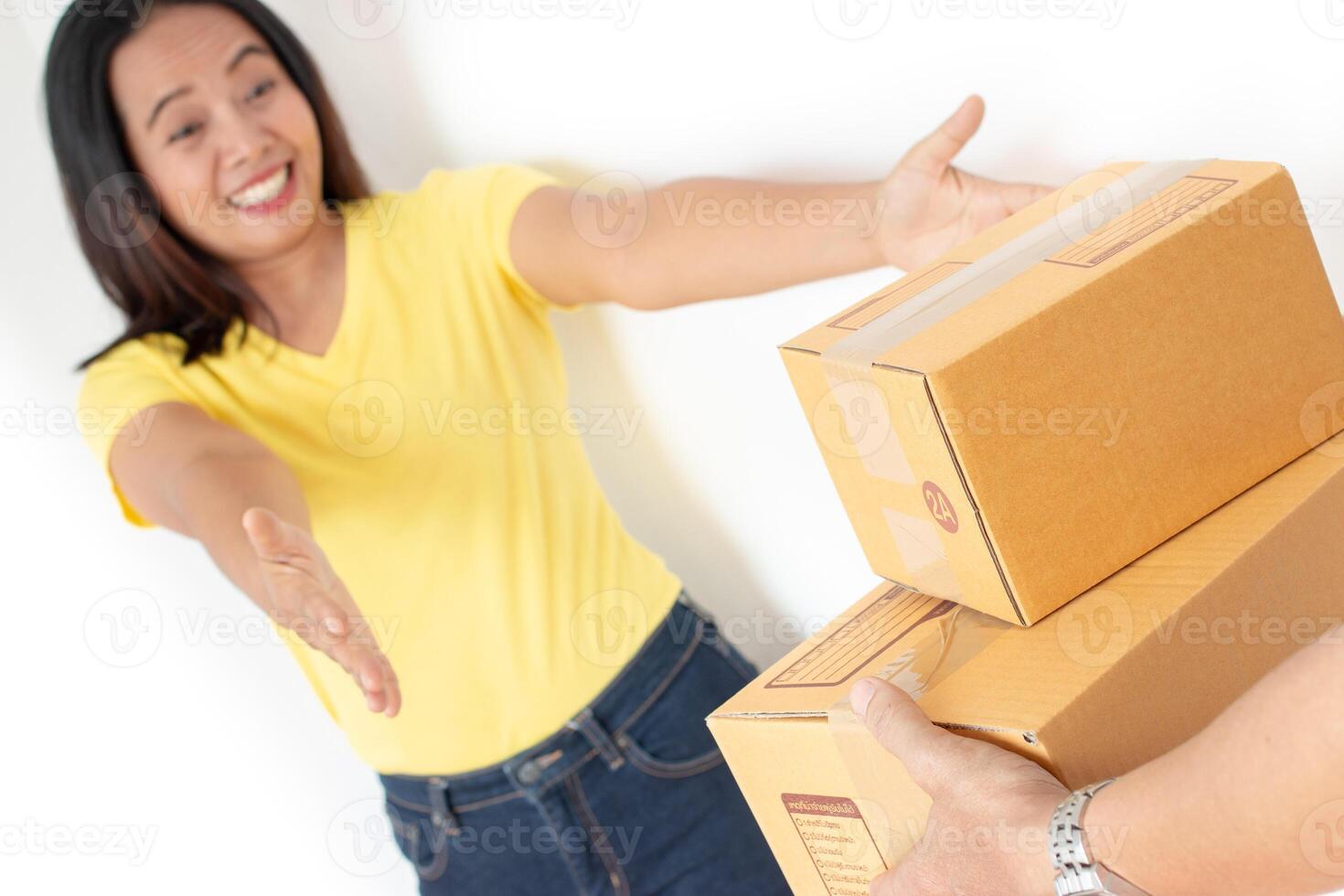 Woman receiving parcel from delivery man. photo