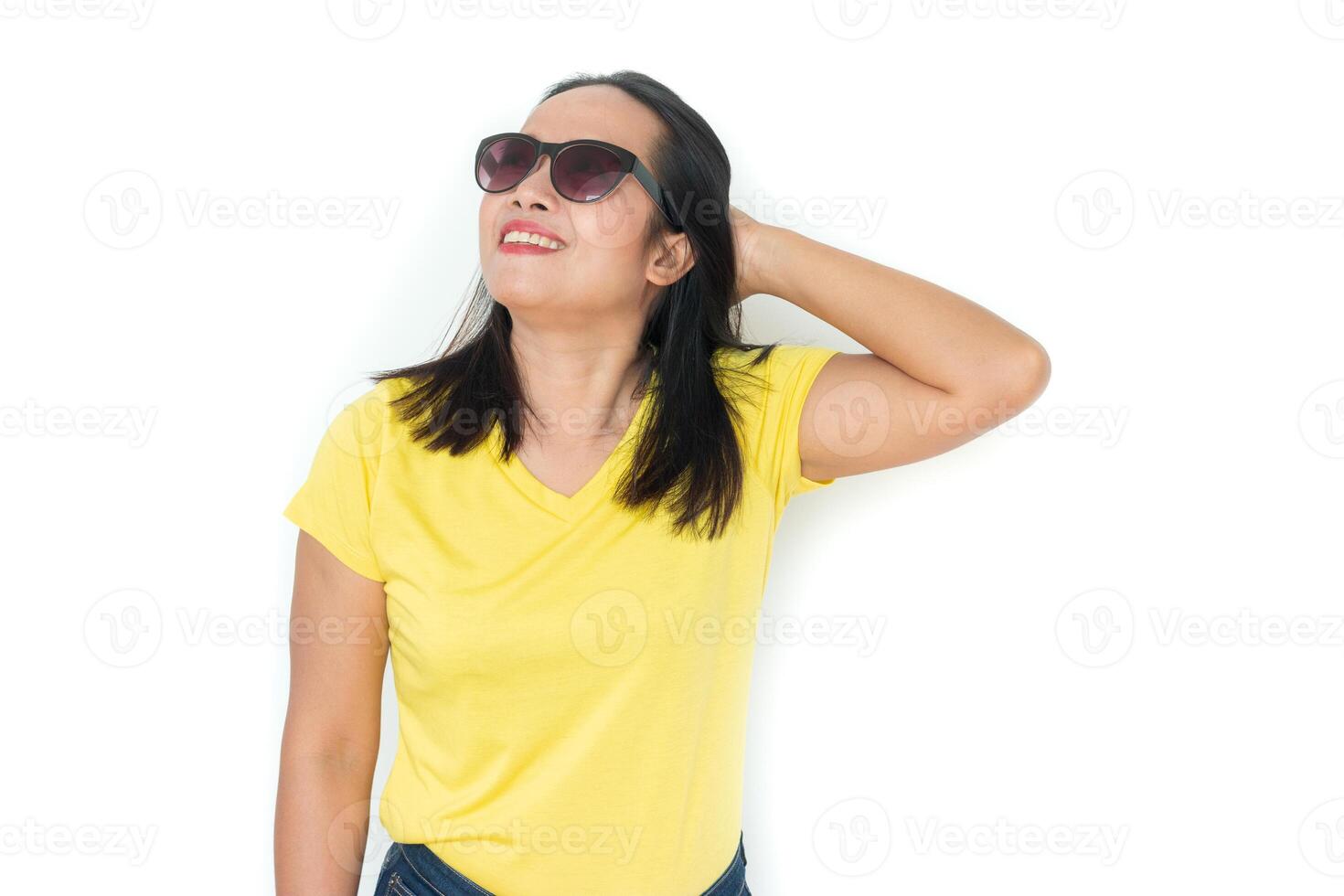 Close up shot of stylish woman in sunglasses smiling on white background. photo