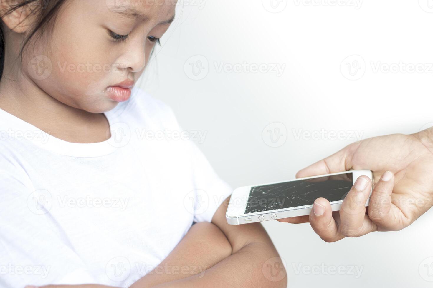 Girl she doesn't accept That the mother's mobile phone was broken. photo