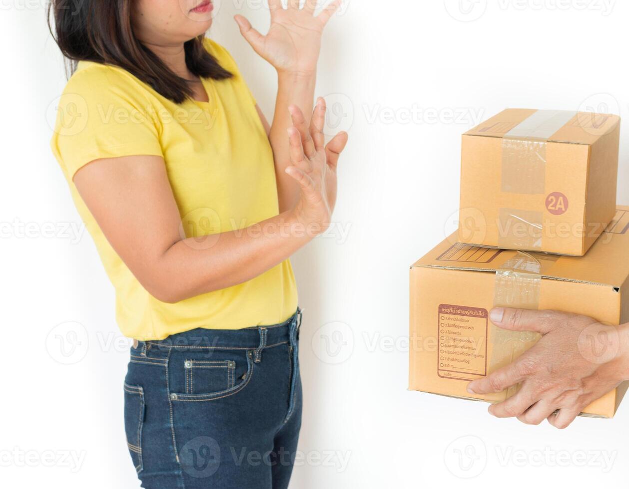 Woman receiving parcel from delivery man. photo
