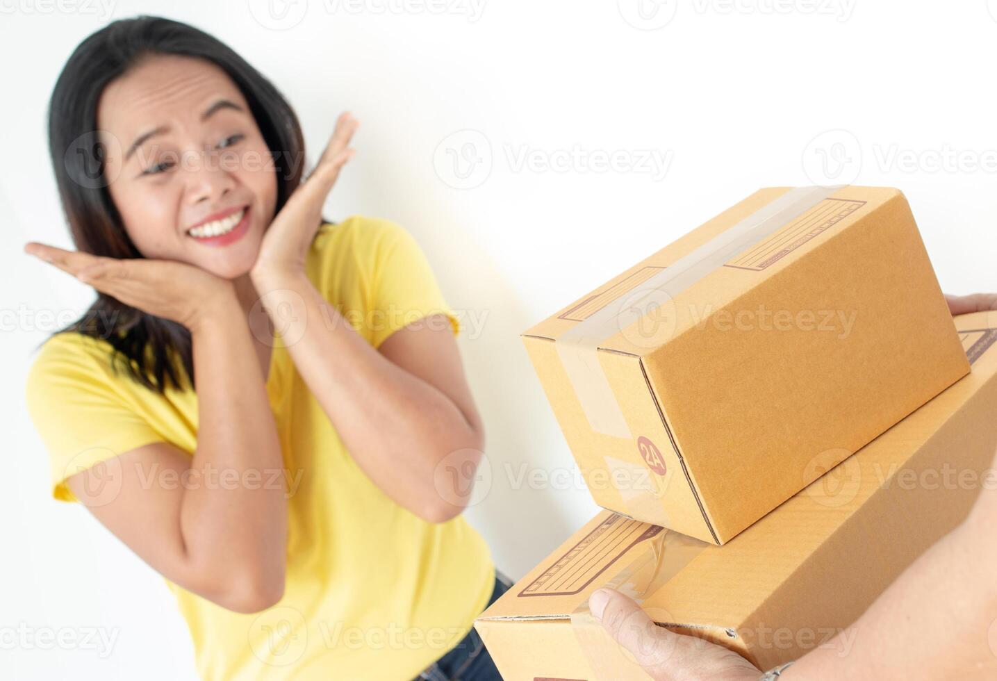 Woman receiving parcel from delivery man. photo