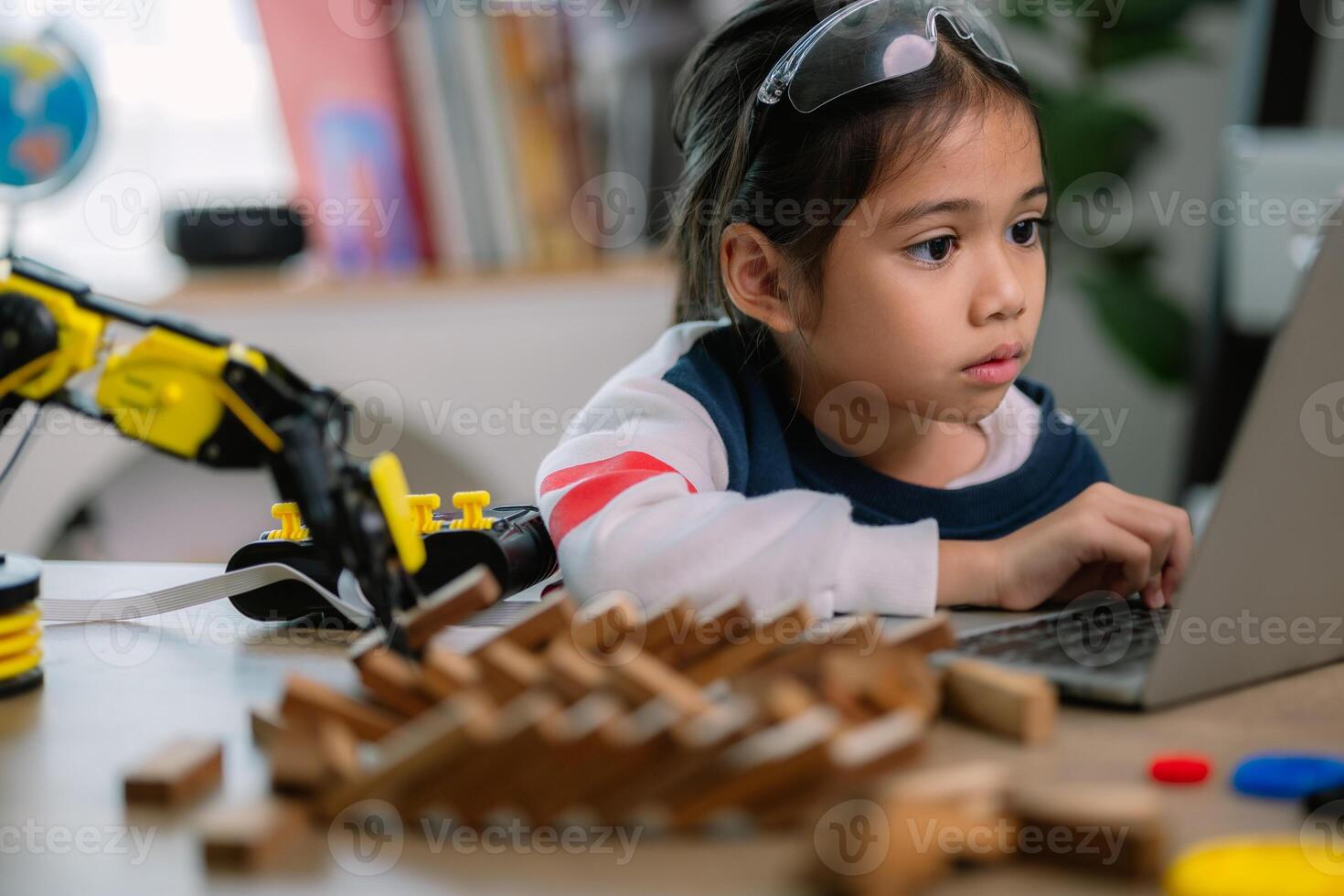 Asian girls were learning robot programming and getting lessons control on robot arms. Laboratory. Mathematics, engineering, science, technology, computer code, coding. STEM education. photo