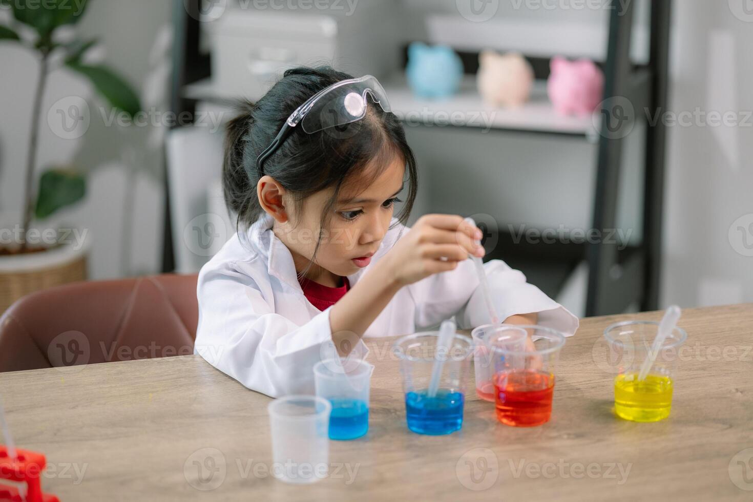 Asian girl doing chemical experiments at the lab photo