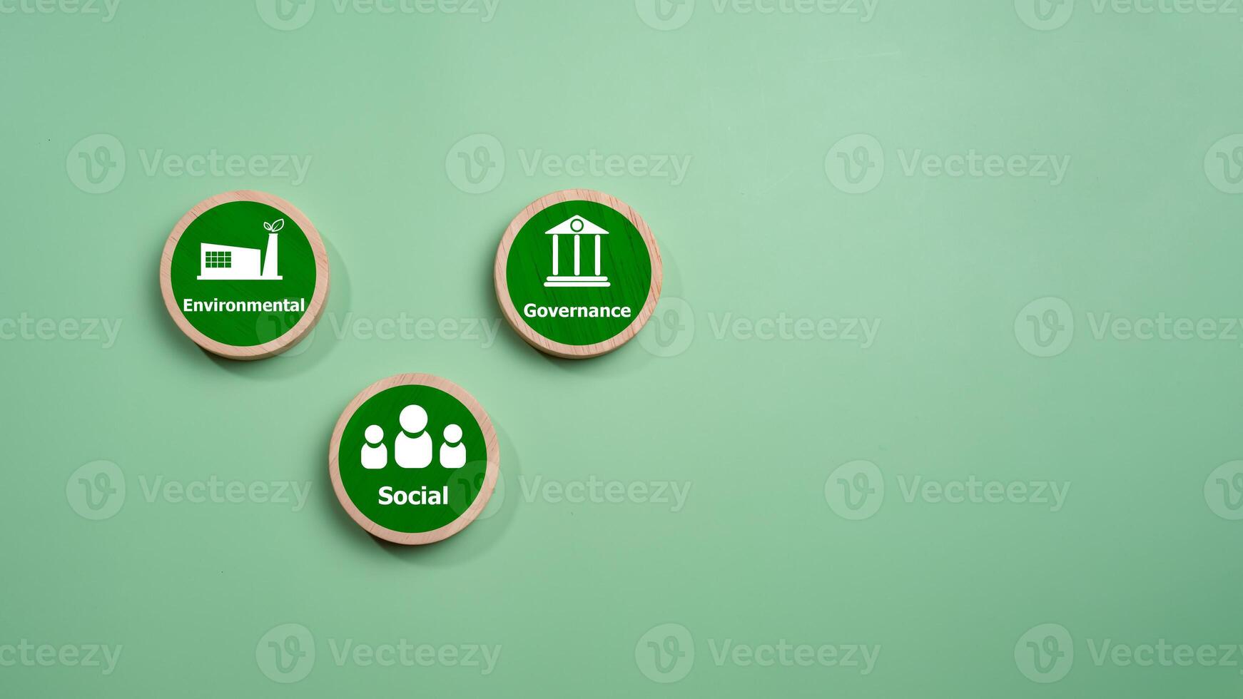 ESG concepts for sustainable environment, society and governance Businesses are environmentally responsible, A circular wooden board with the abbreviation ESG printed on a green background. photo