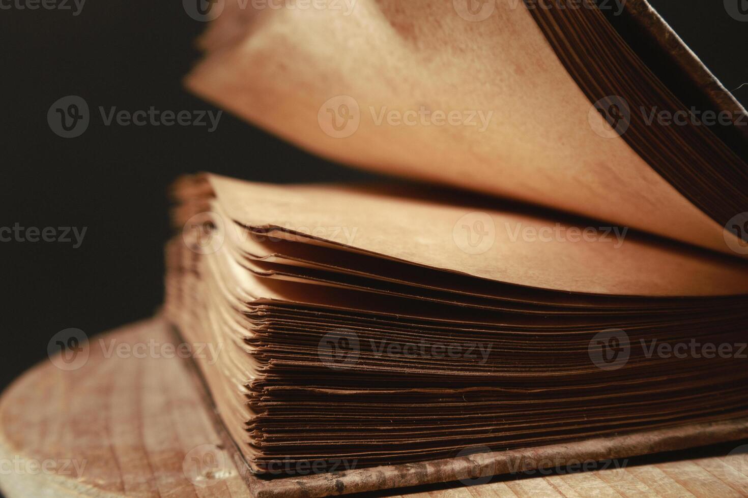 Close up of an aged half open magic book photo