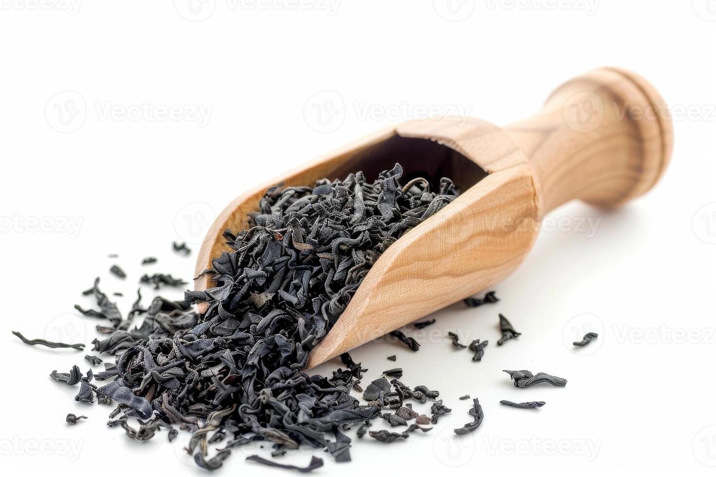 AI generated Black Tea Dried Leaves in Wooden Scoop Isolated on White Background photo