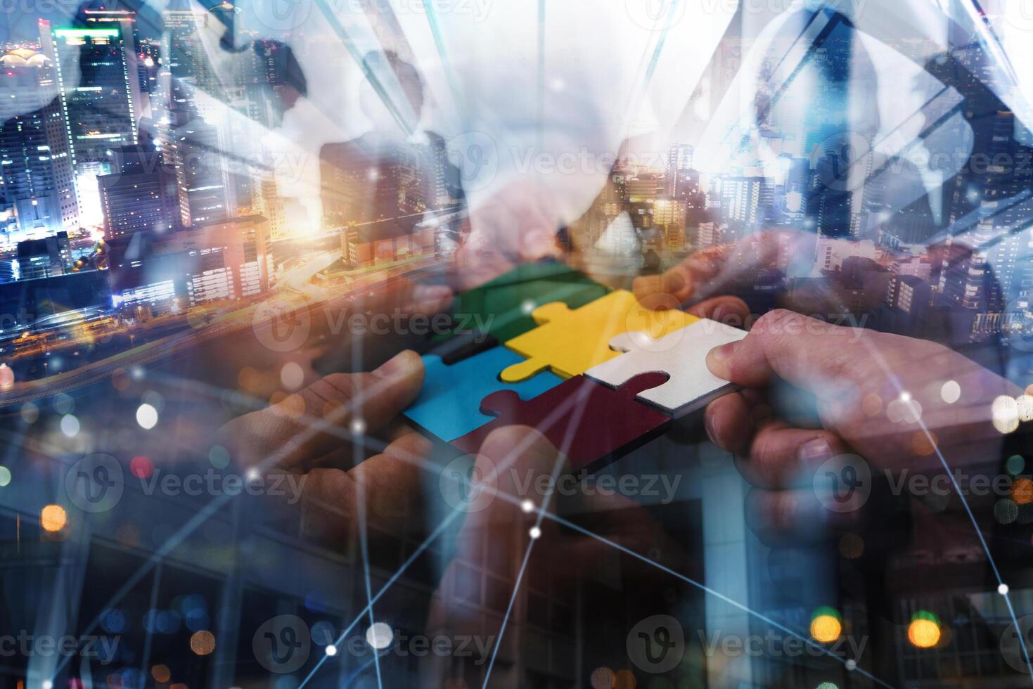 Teamwork of partners connect puzzle pieces as integration and startup photo