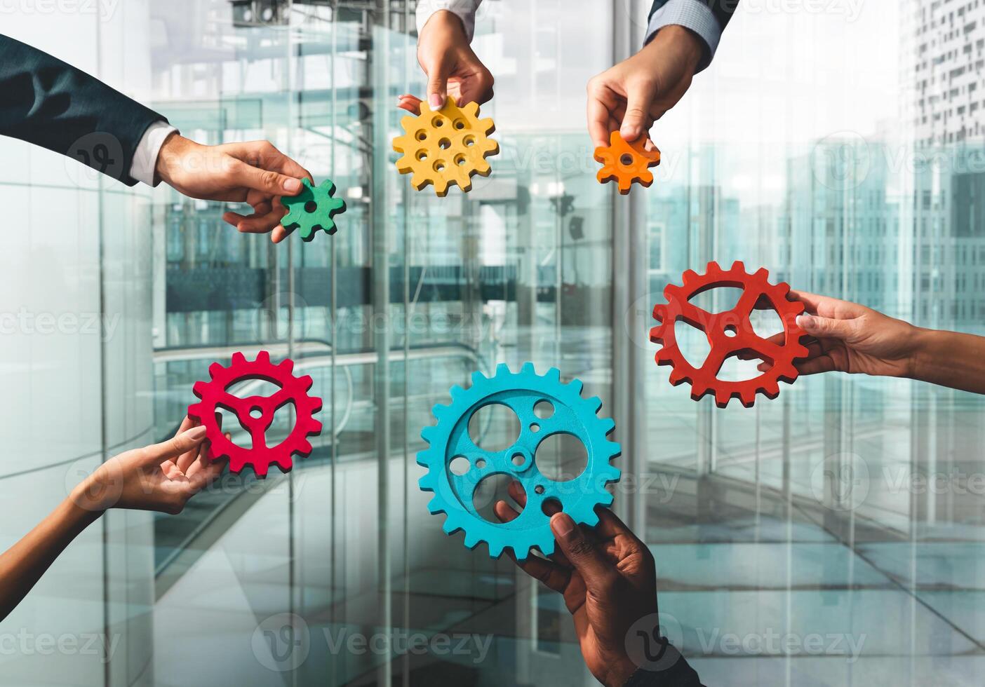 Business team connect pieces of gears like a teamwork and partners photo