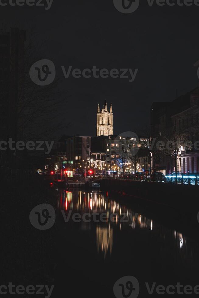 Evening city centre of Ghent in the Flanders region, Belgium. View of the Belfry of Ghent. The very famous towers that are landmarks of Gante photo