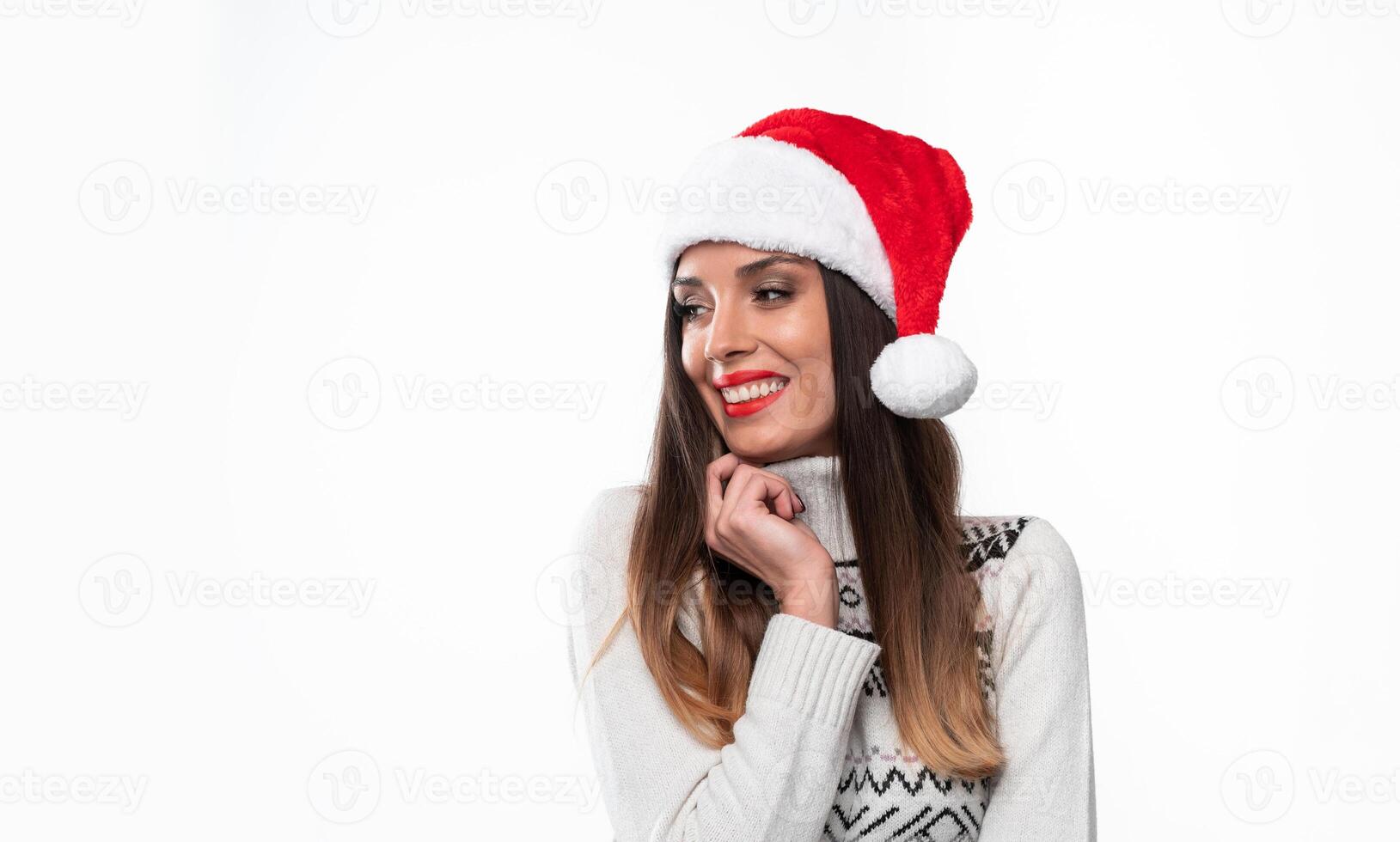 Close up portrait beautifiul caucasian woman in red Santa hat on white studio background. Christmas and New Year holiday concept. photo