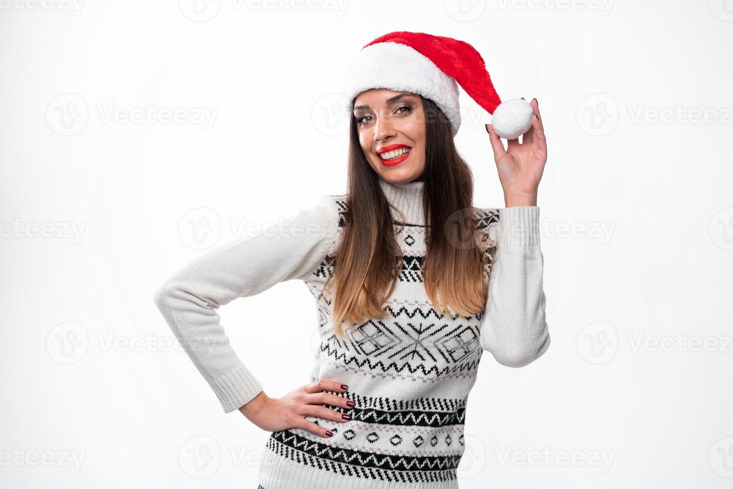 Close up portrait beautifiul caucasian woman in red Santa hat on white studio background. Christmas and New Year holiday concept. photo