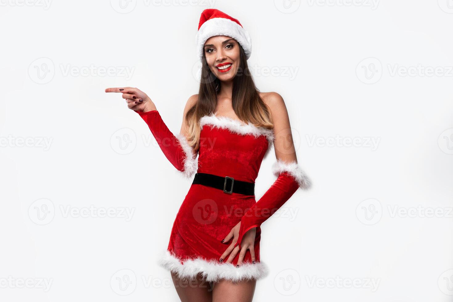 Close up portrait beautifiul caucasian woman in red Santa hat on white studio background. Christmas and New Year holiday concept. photo