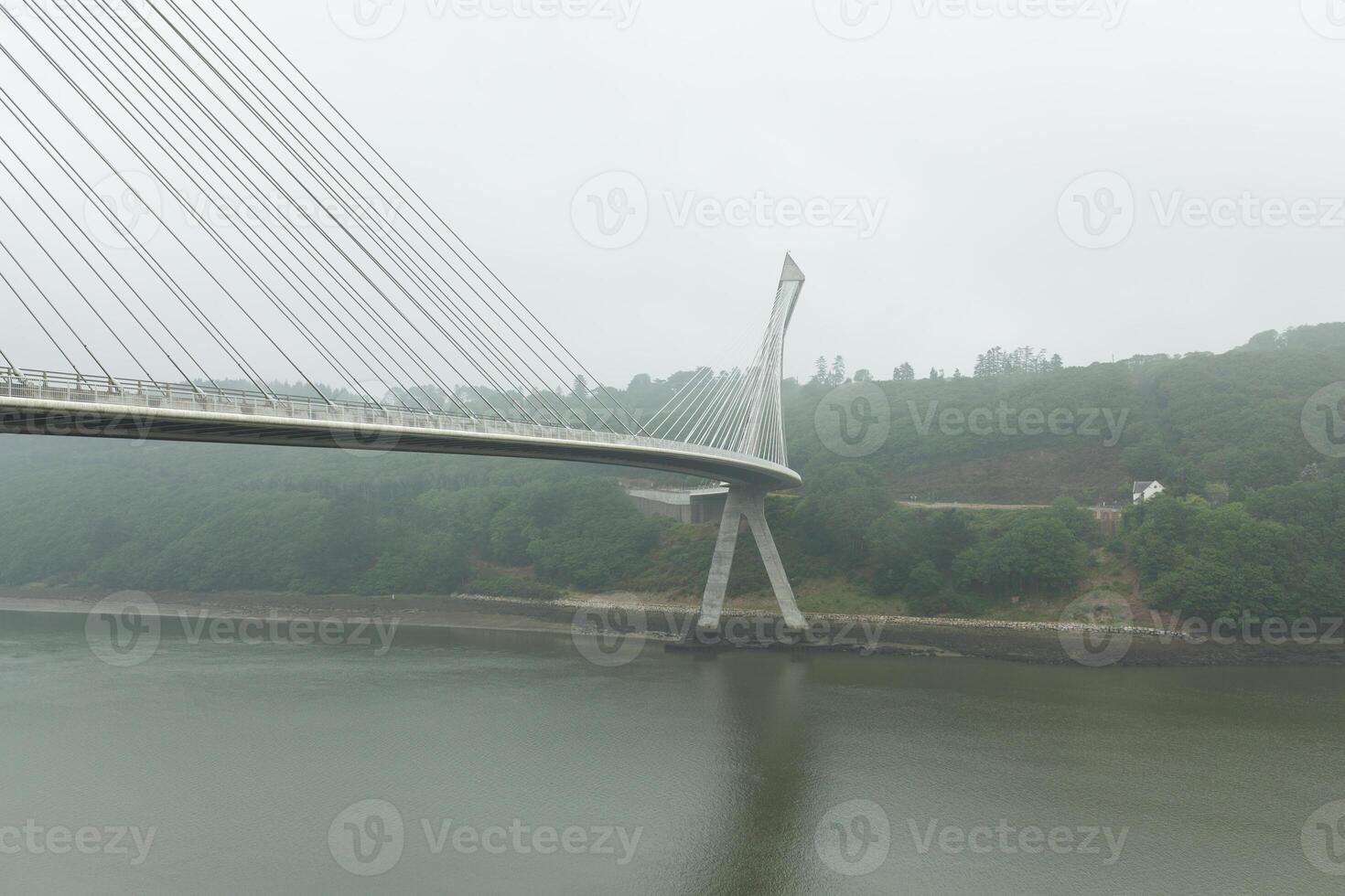 View of a cable-stayed bridge Pont de Terenez in France on a sunny summer morning photo