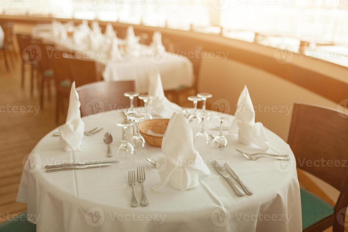 Beautiful table served with glassware and cultery, prepared for festive event. Special occasion celebrted in luxury restaurant or cafe. Table setting concept. Wedding table photo