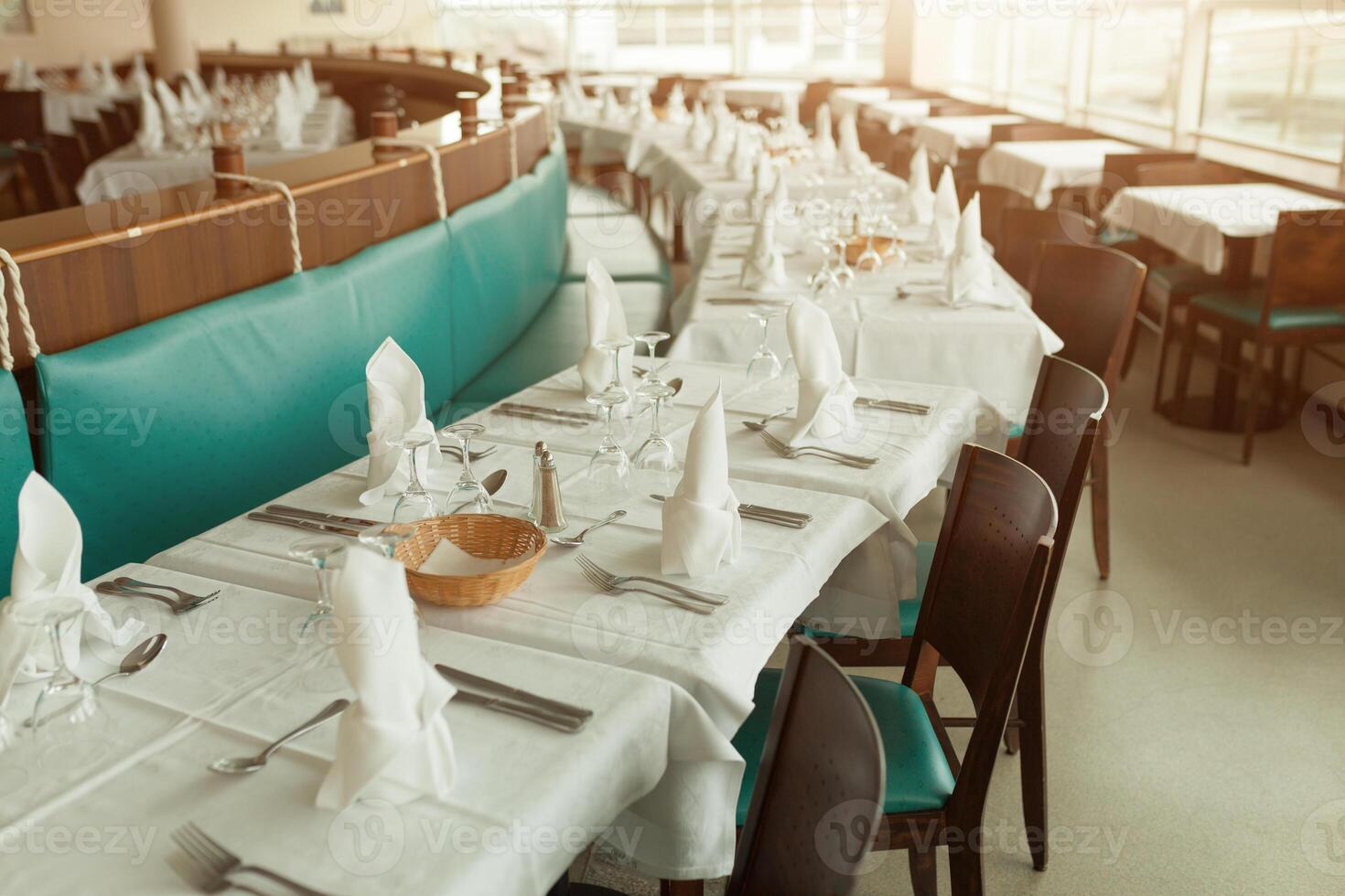 Beautiful table served with glassware and cultery, prepared for festive event. Special occasion celebrted in luxury restaurant or cafe. Table setting concept. Wedding table photo